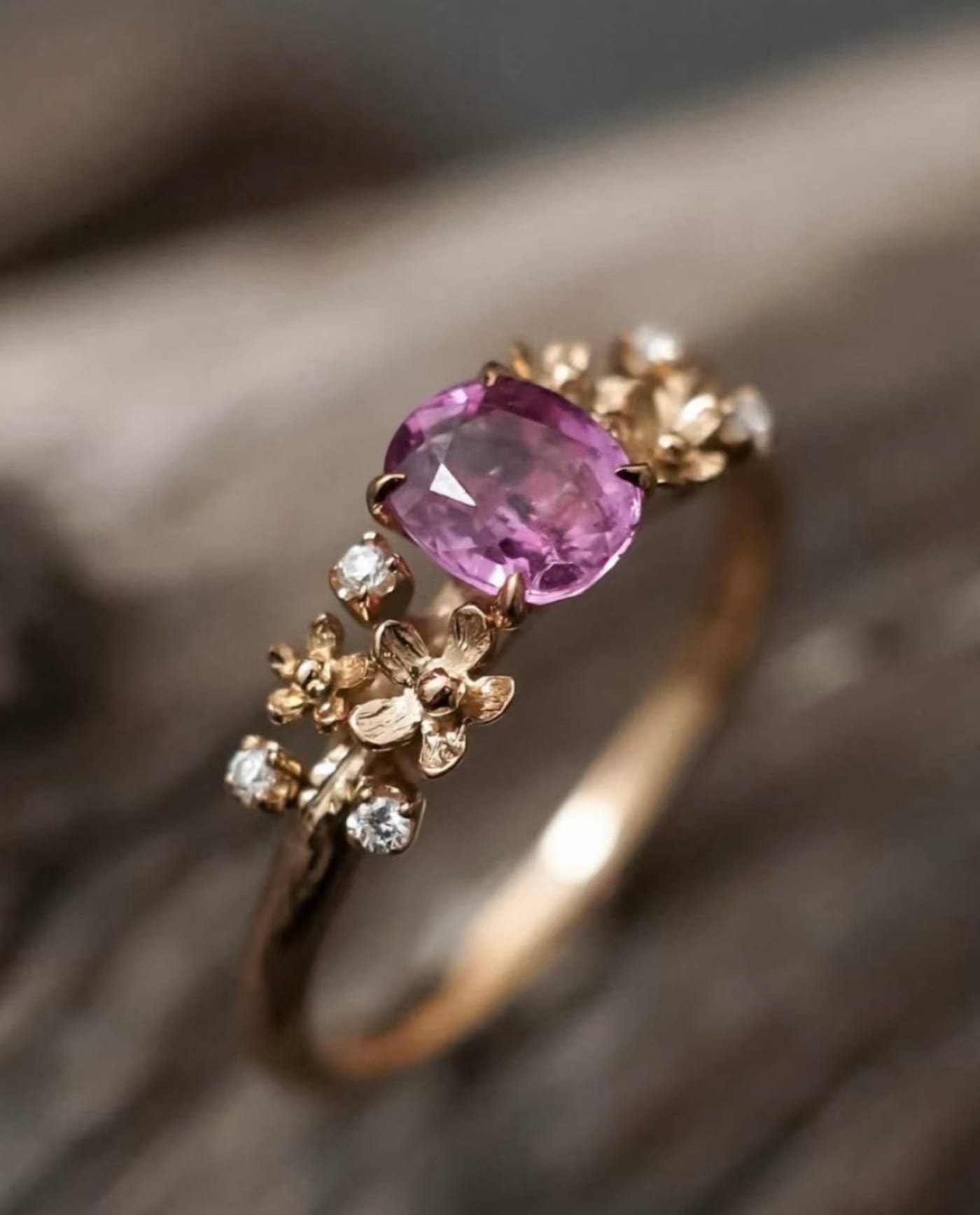 Pink sapphire ring with gold blossoms and diamonds