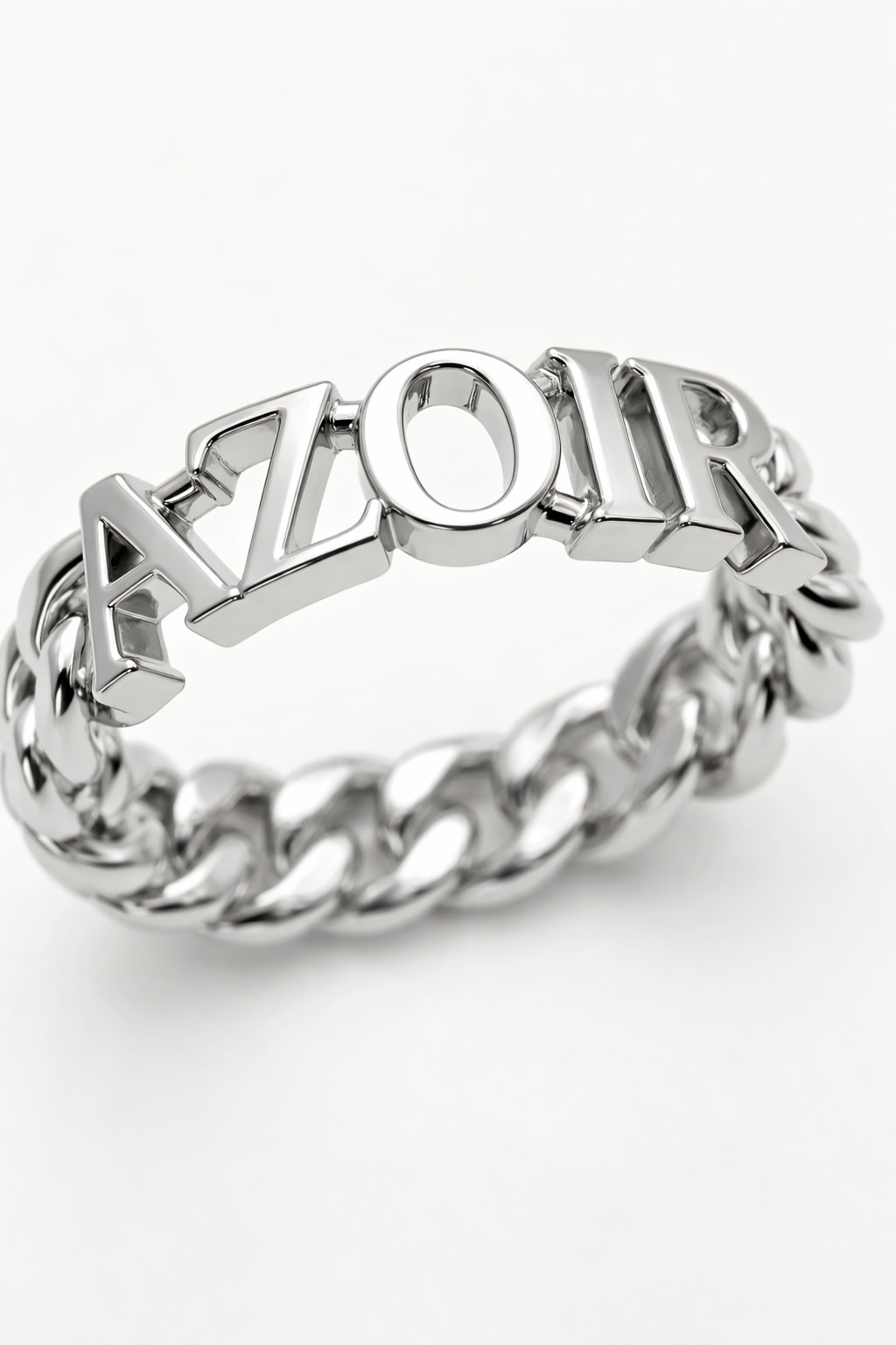 A 3D render of a polished ring spelling AZOIR in block letters on a curb-chain band